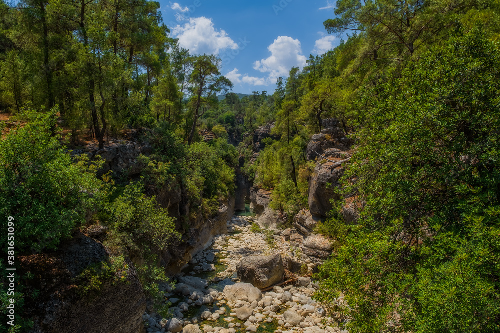 Creek eroded rocks. Flowing stream between rocks. Antalya Koprulu Canyon. Turkey, august 2020