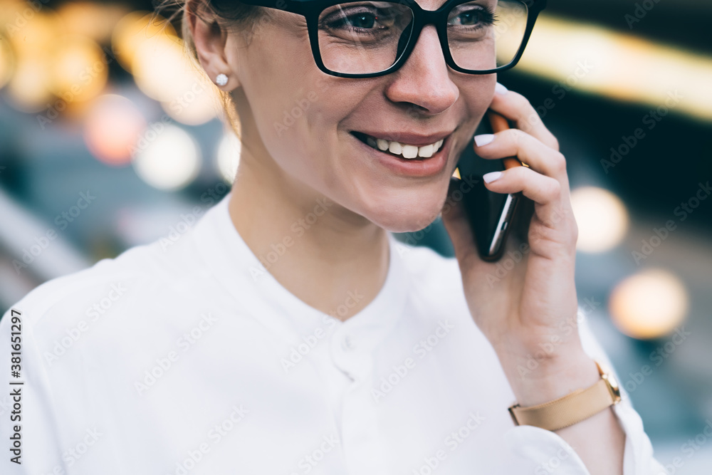Positive woman talking on phone and smiling Positive woman talking on phone and smiling