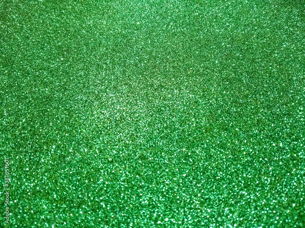 Fototapeta premium Green glitter with selective focus.
