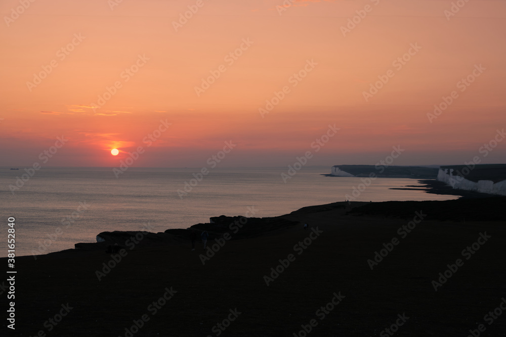 Sunset over the English Channel at Seven Sisters chalk cliffs
