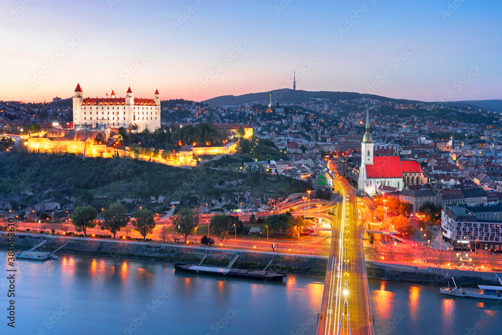 Obraz premium Bratislava castle over Danube river and Bratislava old town, Slovakia