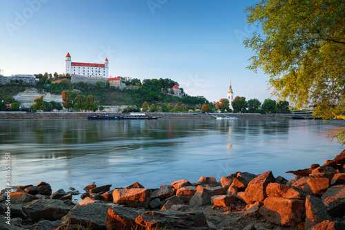 Photography Bratislava castle over Danube river and Bratislava old town, Slovakia