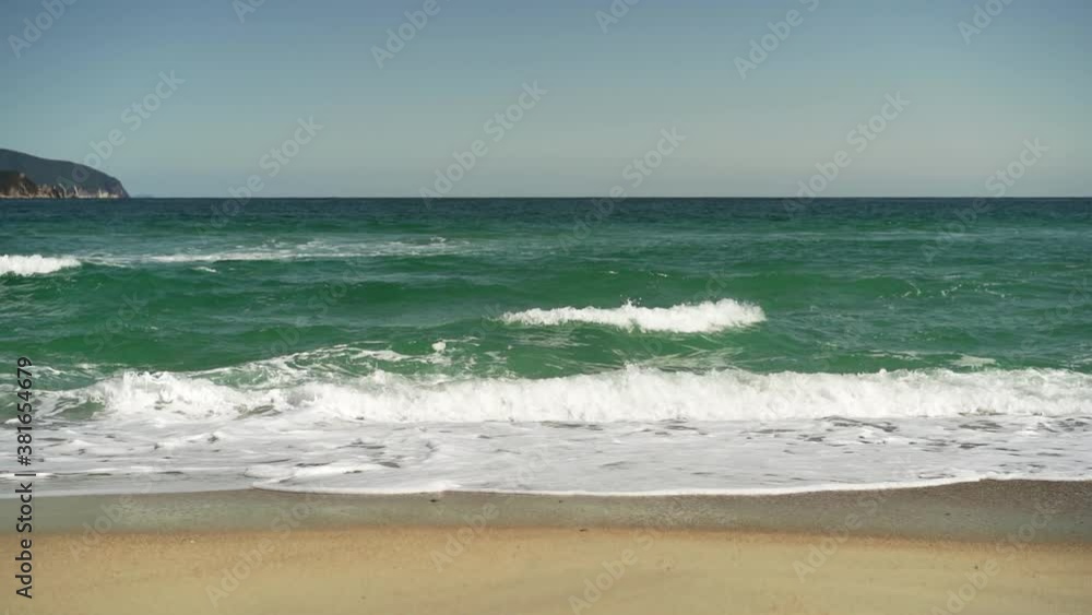 Beautiful seascape with waves and sandy beach. Beautiful seascape with waves and sandy beach.