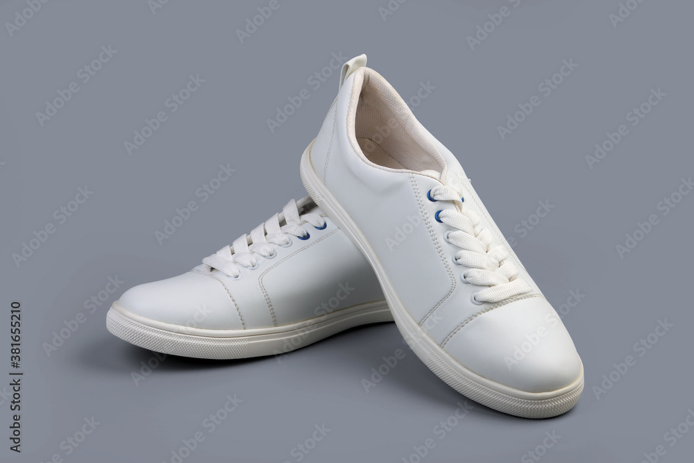 White casual shoes on gray background White casual shoes on gray background