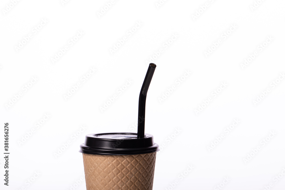 Modern craft disposable paper cup with eco-friendly black glass straw isolated on white background. Coffee to go, takeaway hot drinks, coffee shop cafe ads, recycling, reusable concept. Copy space Modern craft disposable paper cup with eco-friendly black glass straw isolated on white background. Coffee to go, takeaway hot drinks, coffee shop cafe ads, recycling, reusable concept. Copy space