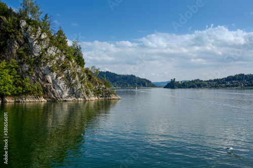 calm waters of the Czorsztyn Lake and the Niedzica Castle in the background, Poland