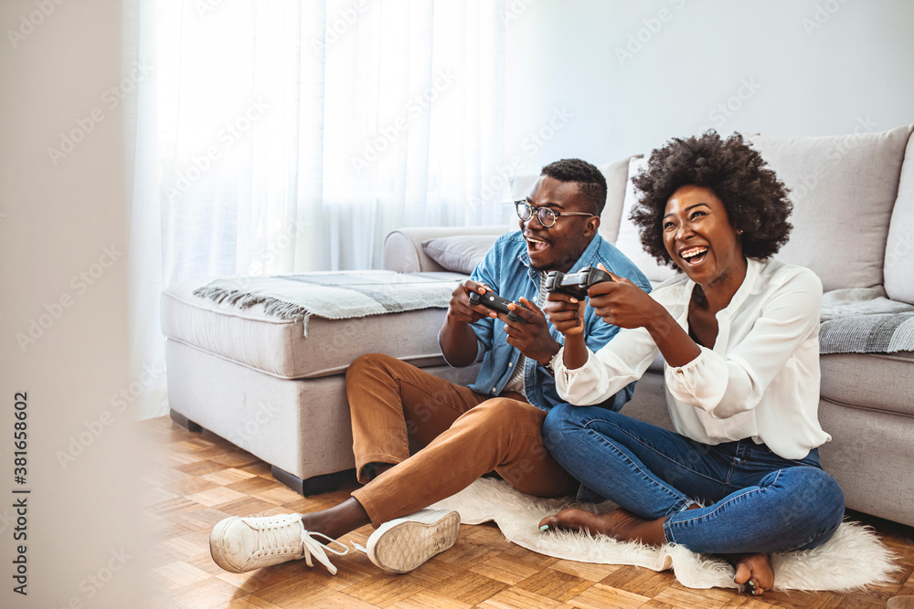 Joyful couple winning video games with joystick on console in studio.  Boyfriend and girlfriend playing online game with controller to win,  feeling happy and relaxed with leisure activity Stock Photo - Alamy