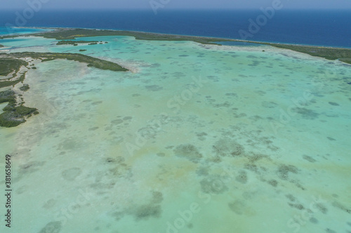 Top view Caribbean Island with mangrove and various shades of blue. Bay from drone look like heaven, Los Roques, National Park