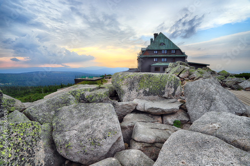 Fototapeta Naklejka Na Ścianę i Meble -  Szrenica mountain shelter (1362 m above sea level) during sunset, Szklarska Poreba, Poland, Europe.