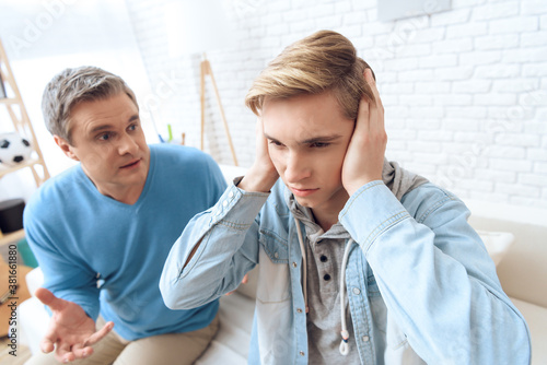 Family problems of dad and son at home.