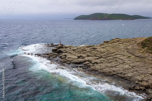 Stormy waves on the coast of Cape Tobizin on the Russian Island in Vladivostok. photo