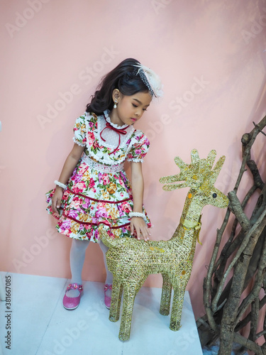 beautiful girl wearing a floral dress in retro style.