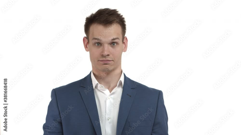 Handsome serious-looking businessman in blue suit, taking-off his glasses and slap forehead, facepalm from something stupid, feeling tired, standing over white background Handsome serious-looking businessman in blue suit, taking-off his glasses and slap forehead, facepalm from something stupid, feeling tired, standing over white background