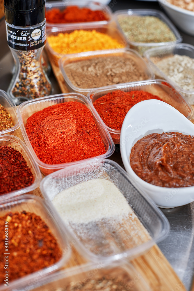 Many different spices, vegetables and ingredients, and fresh herbs for making homemade sauce Many different spices, vegetables and ingredients, and fresh herbs for making homemade sauce