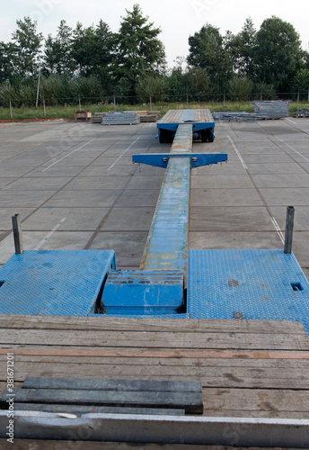 Transport of a aluminium hull part of a super sailing yacht. Ship building industry. Netherlands. Shipyard.