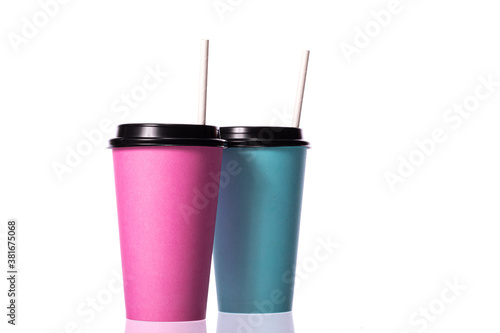 Colorful pink blue paper cups with straws isolated on white background. Coffee to go, takeaway hot drinks, gender reveal, student cocktail party, cafe, boys girls concept, mockup template. Copy space