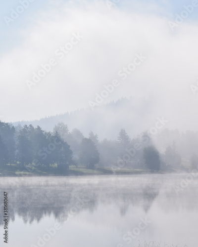 Fog over a lake in the morning in Lipno Nad Vltavou, Czech Republic