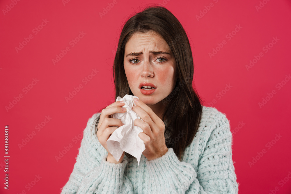 Image of unhappy beautiful girl with flu holding napkin Image of unhappy beautiful girl with flu holding napkin