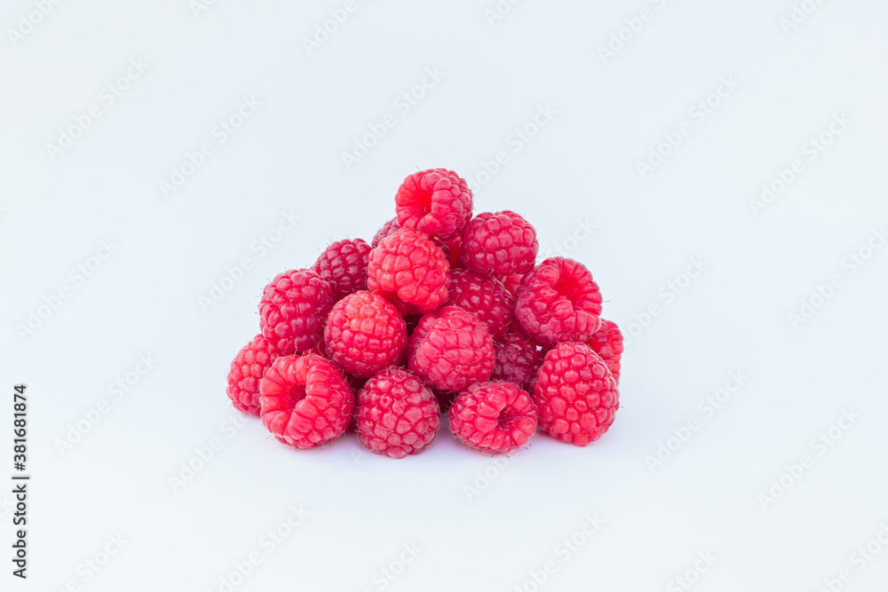 appetizing raspberries on a white background, a bunch of juicy ripe fresh berries appetizing raspberries on a white background, a bunch of juicy ripe fresh berries