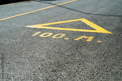 Arrow on the road, yellow color background