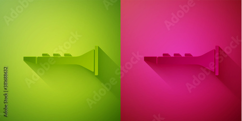 Paper cut Clarinet icon isolated on green and pink background. Musical instrument. Paper art style. Vector.