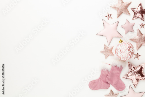 New Year celebration and Christmas background pink stars and Christmas decorations top view.