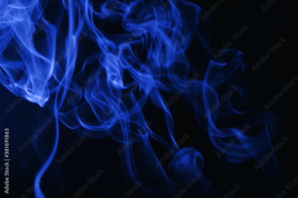 Blue flowing smoke on black background Blue flowing smoke on black background