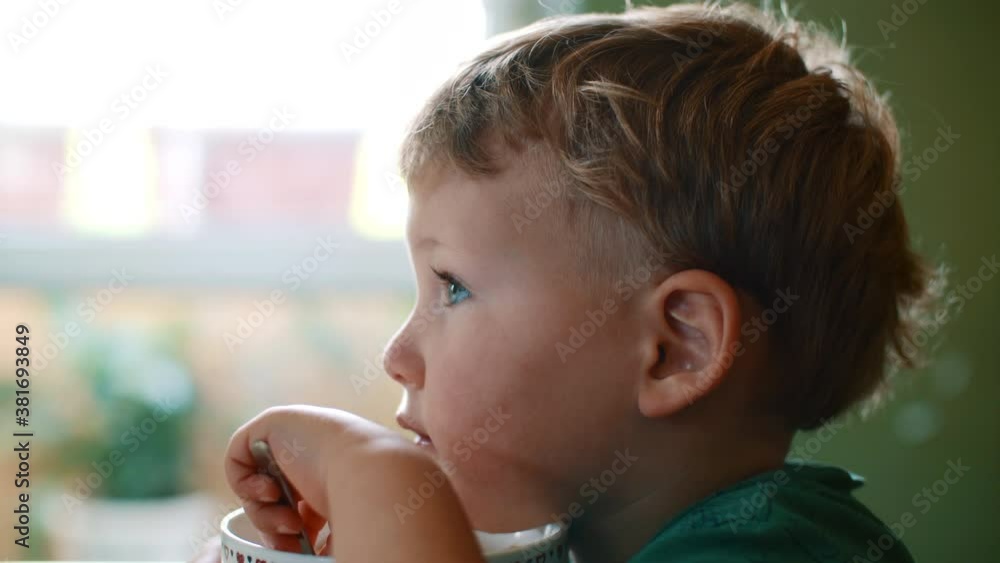 White blond child boy close up watches with interest. White blond child boy close up watches with interest.