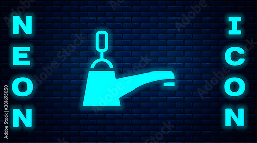 Glowing neon Water tap icon isolated on brick wall background. Vector.