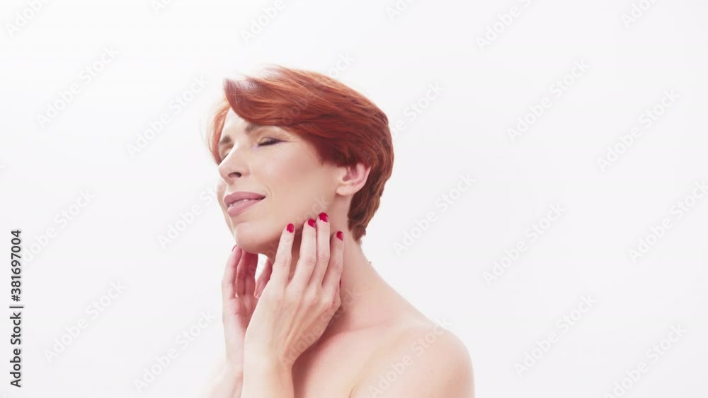 Young attractive 40s woman model on white background. Beauty and skincare concept. Young attractive 40s woman model on white background. Beauty and skincare concept.
