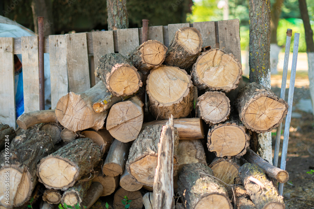 stack of wooden log cut for winter season in the countryside house yard stack of wooden log cut for winter season in the countryside house yard