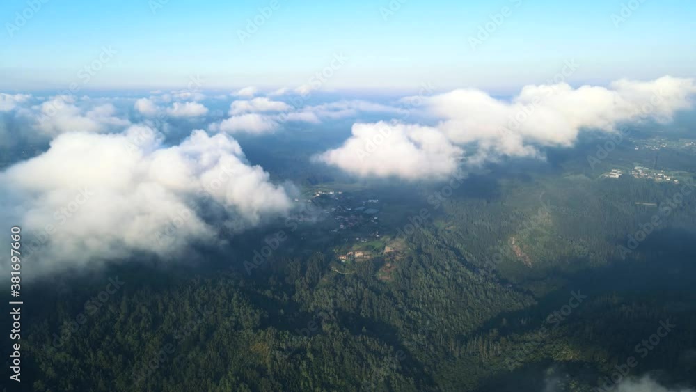 beautiful aerial shot of mountains from above the clouds on a cloudy day beautiful aerial shot of mountains from above the clouds on a cloudy day