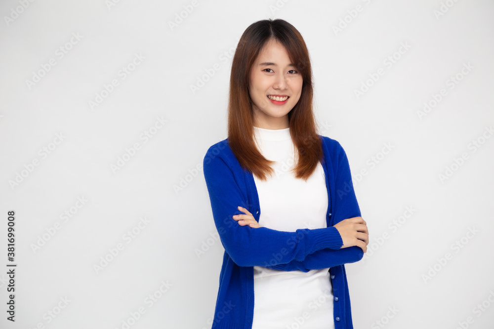 Portrait of happy young asian woman with arms crossed and smile isolated over white background Portrait of happy young asian woman with arms crossed and smile isolated over white background