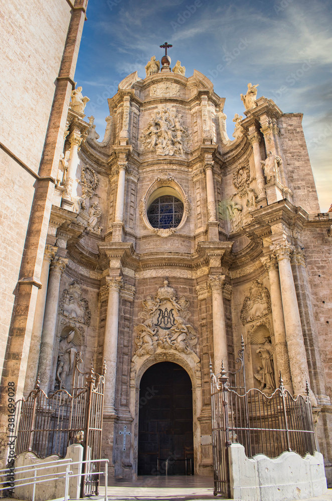 Door of Los Hierros and baroque facade of the cathedral of Valencia, Spain