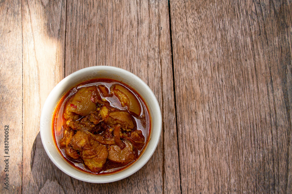Hung lay curry or hinlay curry on wooden table Hung lay curry or hinlay curry on wooden table