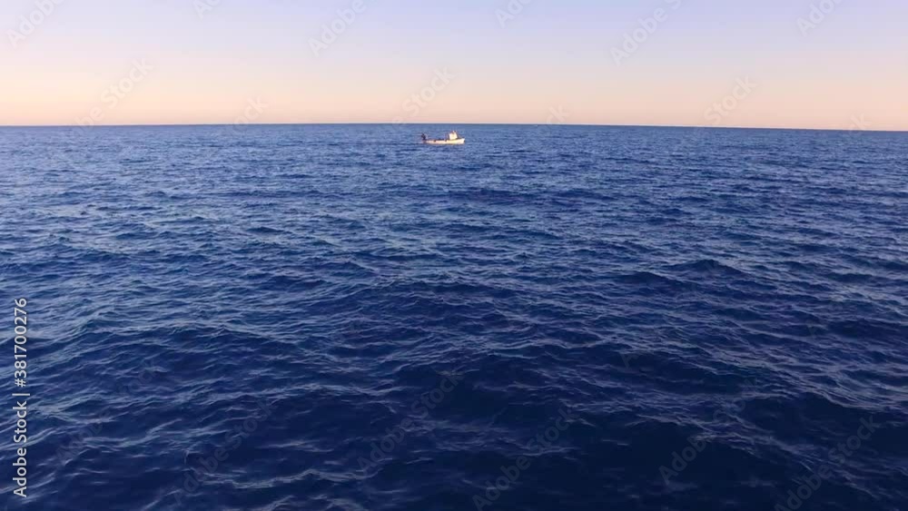 Fishing boat in the sea aerial view. Transportation boat in the ocean. Industry, transport, shipping in the ocean, marine commerce. Fishing boat in the sea aerial view. Transportation boat in the ocean. Industry, transport, shipping in the ocean, marine commerce.