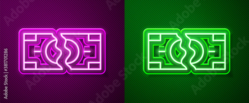 Glowing neon line Tearing apart money banknote into two peaces icon isolated on purple and green background. Vector.