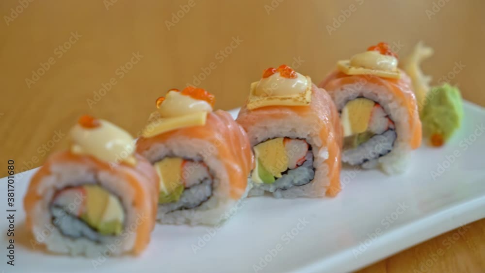salmon roll sushi with cheese on top - Japanese food style salmon roll sushi with cheese on top - Japanese food style
