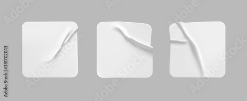 White square glued stickers mock up set. Blank white adhesive square paper or plastic sticker label with wrinkled, crumpled effect. Blank template label tags. 3d realistic vector