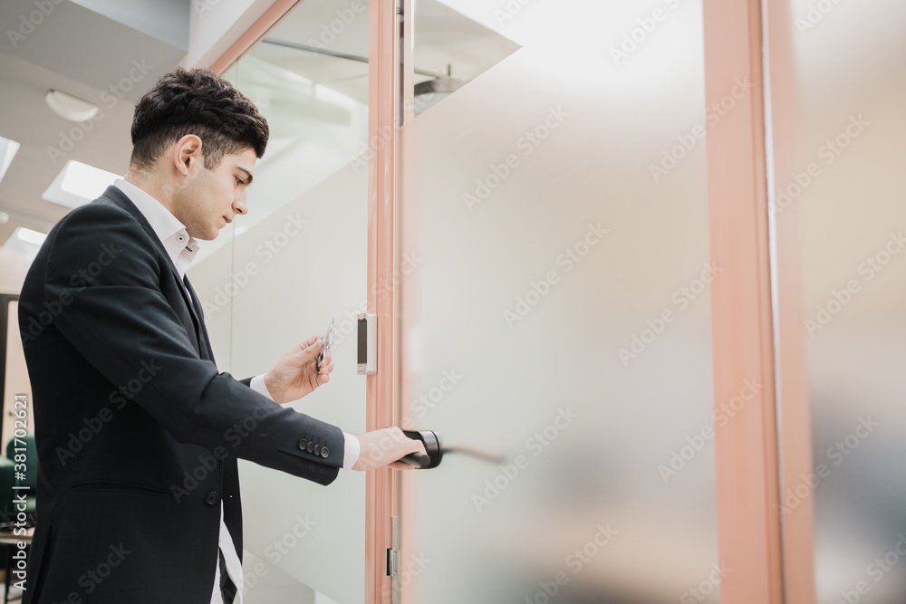 a new manager opens the door to his office in a strict business suit, Caucasian appearance, short hairstyle, strong barbershop a new manager opens the door to his office in a strict business suit, Caucasian appearance, short hairstyle, strong barbershop