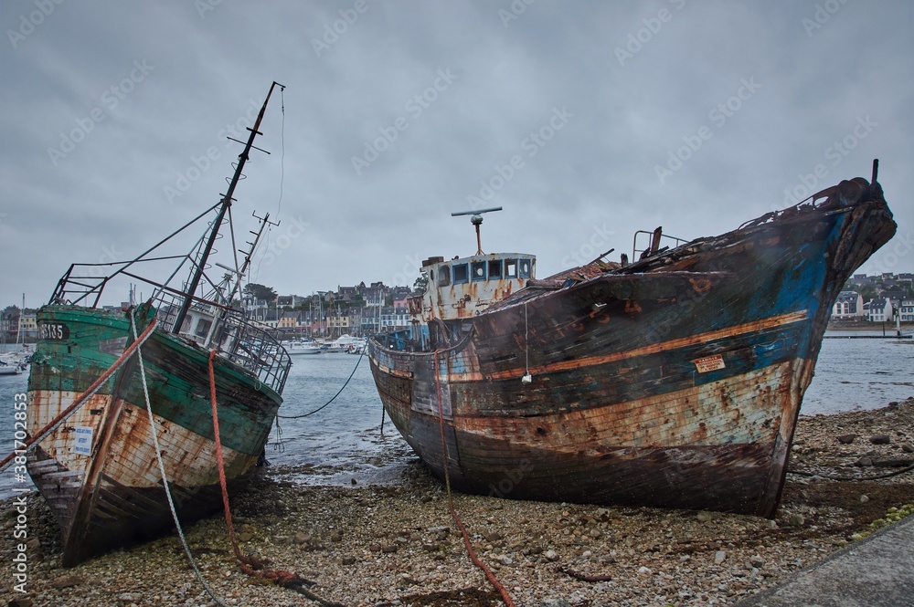 Abandoned shipwrecks in a harbor in Brittany, France. Abandoned shipwrecks in a harbor in Brittany, France.