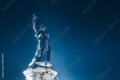 Monument à la République at the center of The Place de la République square, topped by a statue of Marianne in Paris, France photo