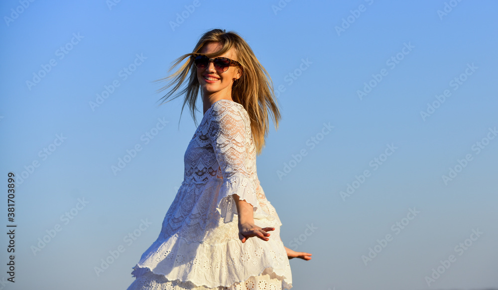 Impulsiveness and ease. Naturalness concept. Dancing woman. Mental health. Girl blue sky background. Emotional girl. Happy girl white dress feel free. Summer party. Sunny day. Carefree girl. Freedom Impulsiveness and ease. Naturalness concept. Dancing woman. Mental health. Girl blue sky background. Emotional girl. Happy girl white dress feel free. Summer party. Sunny day. Carefree girl. Freedom