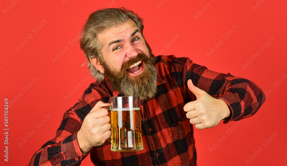 Beer brewery. Brutal hipster drink beer. Happy birthday concept. Make sip. Celebrate with alcohol. Craftsmanship. Mature bearded man hold beer glass. Leisure and celebration. Man drinking beer in pub Beer brewery. Brutal hipster drink beer. Happy birthday concept. Make sip. Celebrate with alcohol. Craftsmanship. Mature bearded man hold beer glass. Leisure and celebration. Man drinking beer in pub