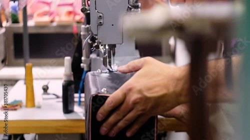 Italian shoemaker, making leather bag with traditional machines.

Location: South Tyrol, Italy