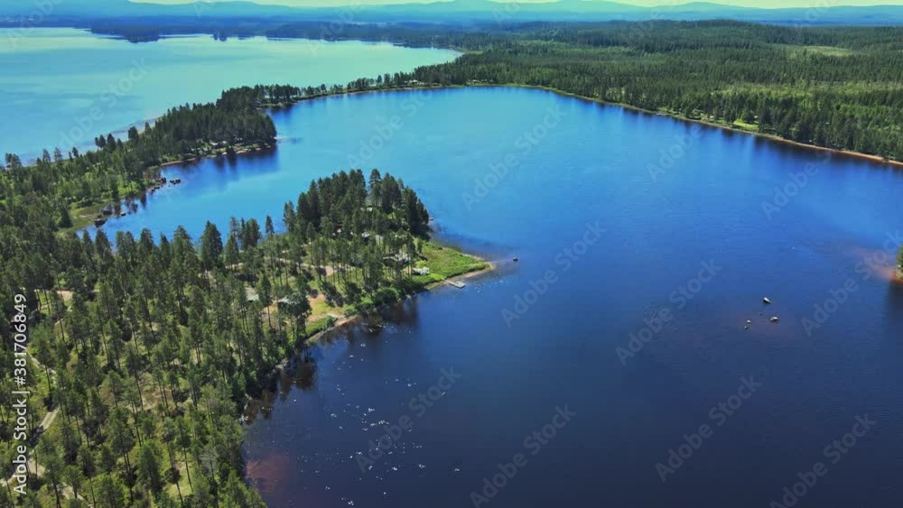 Morning With Beautiful Fall Landscape Scenery Of Calm Blue Lake Surrounded By Lush Pine Tree Forests In Vansbro Municipality, Dalarna County, Sweden - aerial drone Morning With Beautiful Fall Landscape Scenery Of Calm Blue Lake Surrounded By Lush Pine Tree Forests In Vansbro Municipality, Dalarna County, Sweden - aerial drone