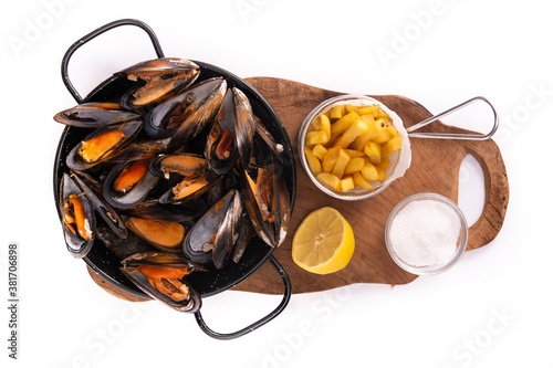 Moussels and french fries or molues-frites isolated on white background. Top view photo