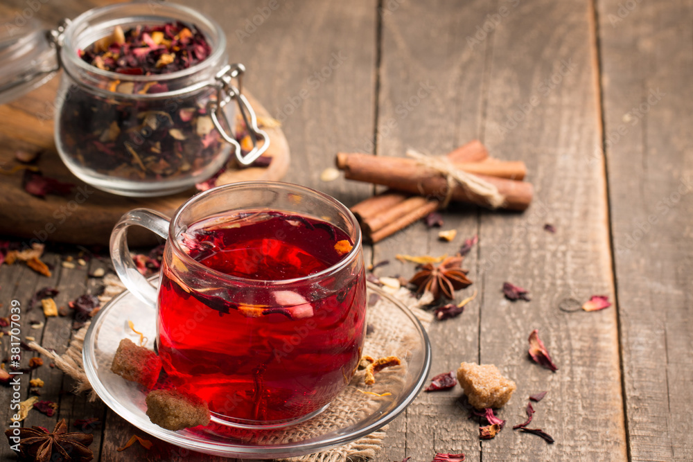 Cup of fresh red tea on wooden background Cup of fresh red tea on wooden background