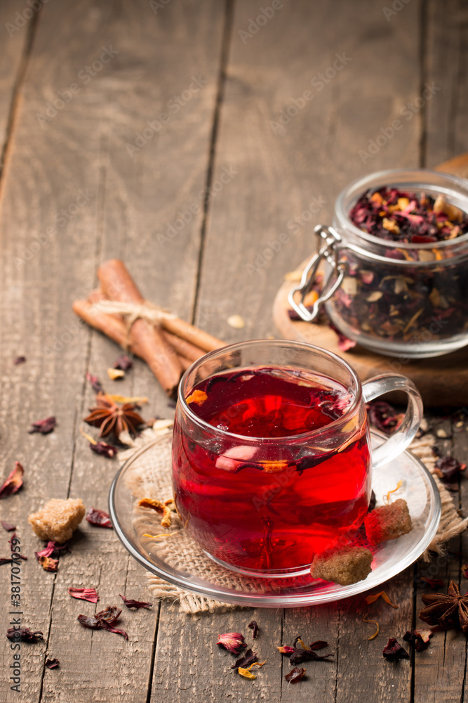Cup of fresh red tea on wooden background Cup of fresh red tea on wooden background