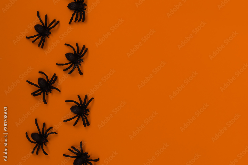 Halloween decorations concept. Halloween with spiders on orange background. Halloween decorations concept. Halloween with spiders on orange background.